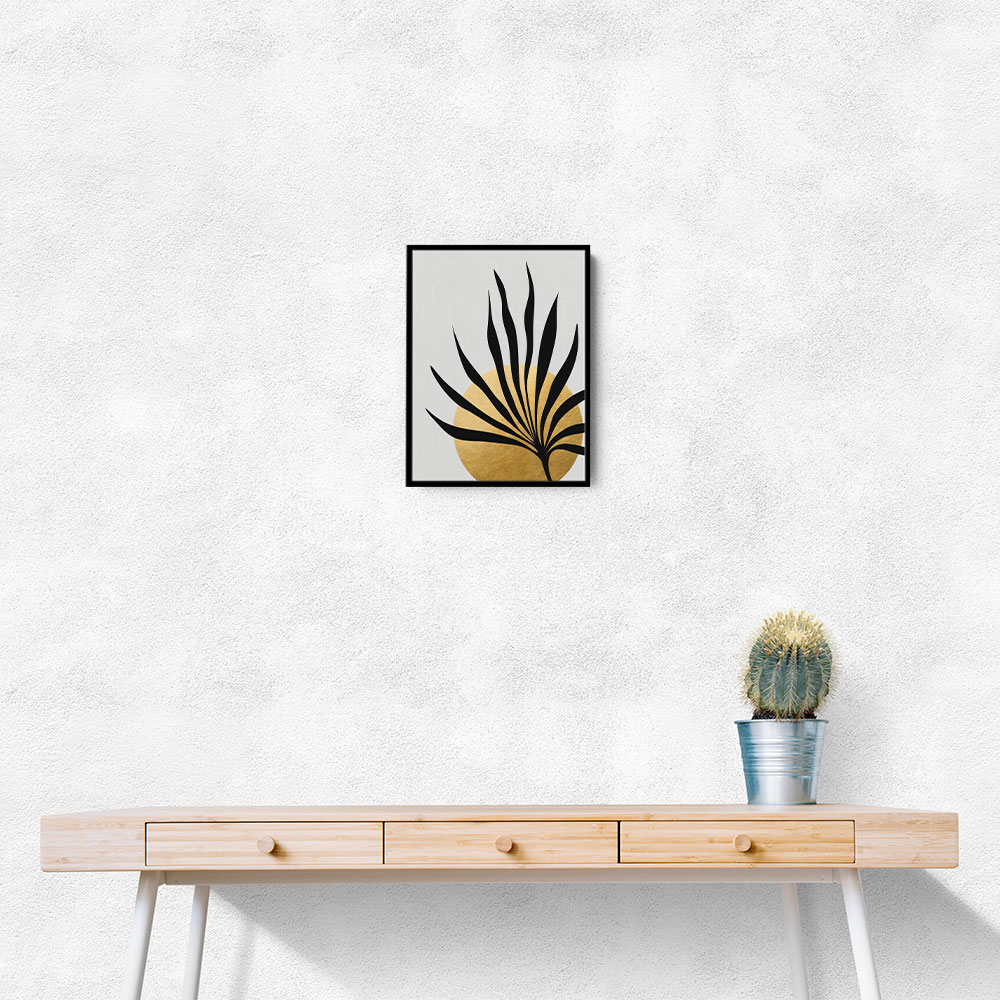 Tropical sun and palm leaf