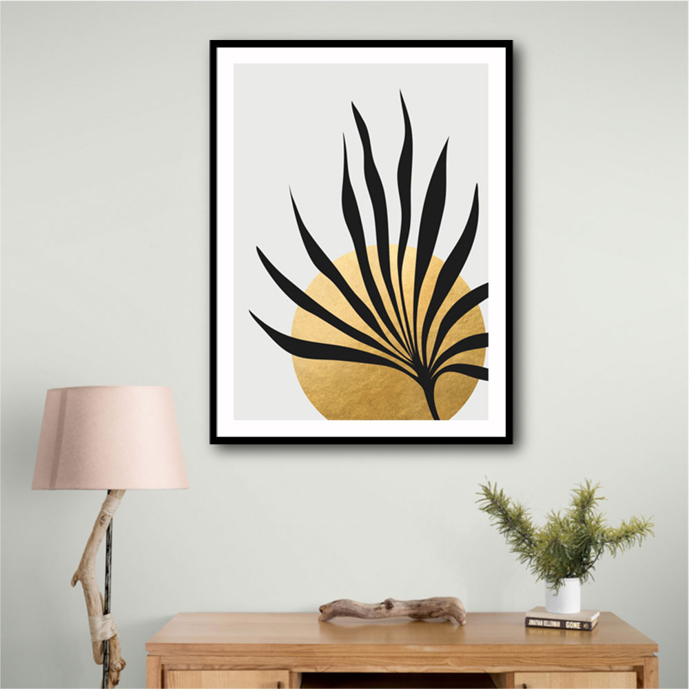 Tropical sun and palm leaf