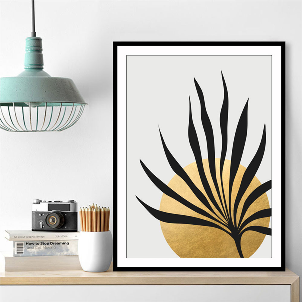 Tropical sun and palm leaf